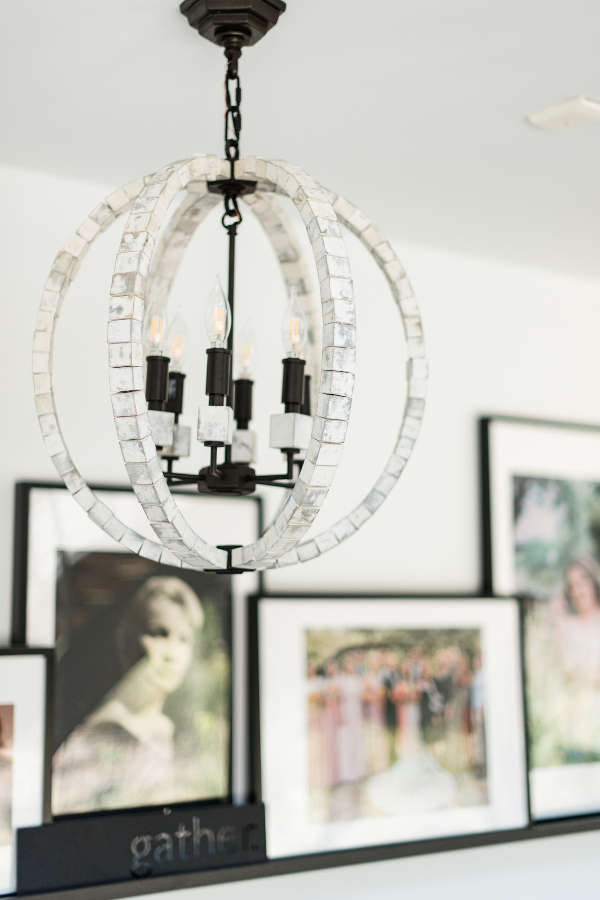 before and after hallway with gallery wall ledges family photos chandeliers runners