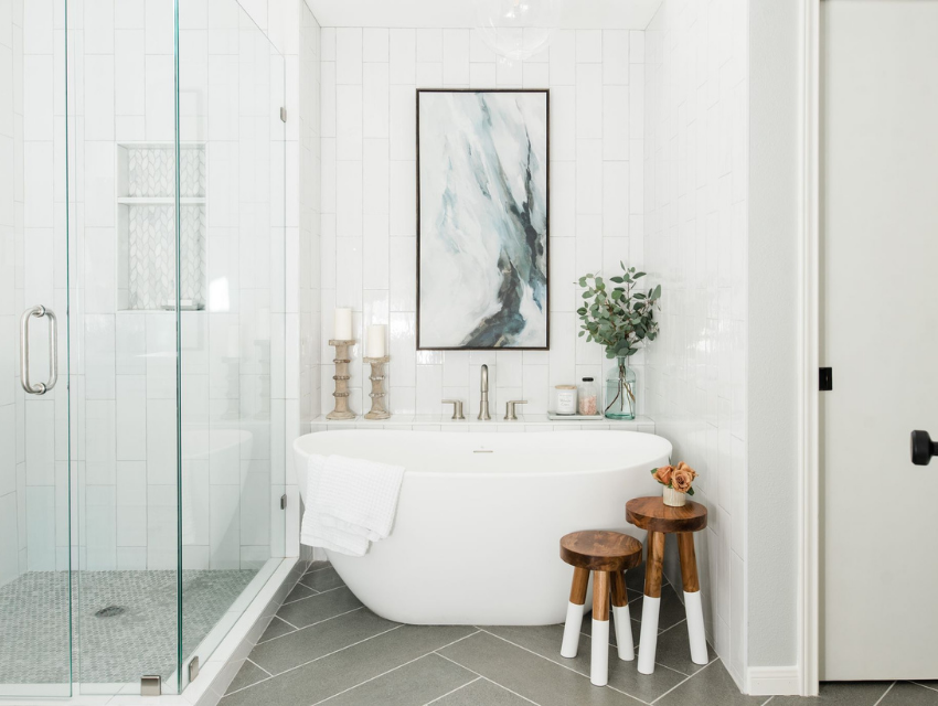 bathroom renovation inspiration white fresh oversize art tub herringbone tile floor gray