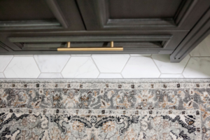 painted-bathroom-vanity-cabinets-black-gold-hardware-hexagon-white-tile-floor-rug-styleberry-creative