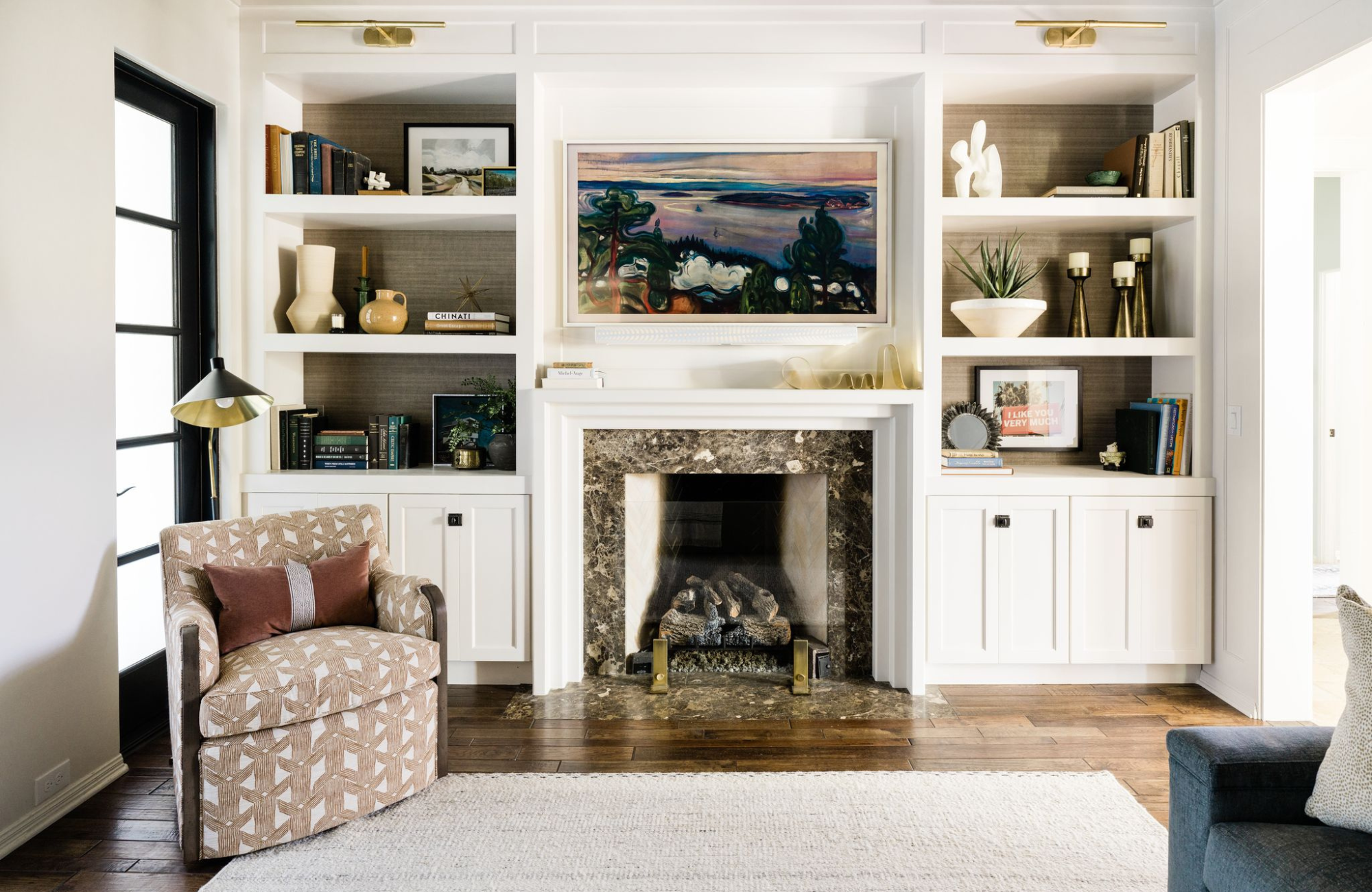 morningside tx living room custom shelving design styleberry creative interiors stone fireplace white built-in upholstered chair