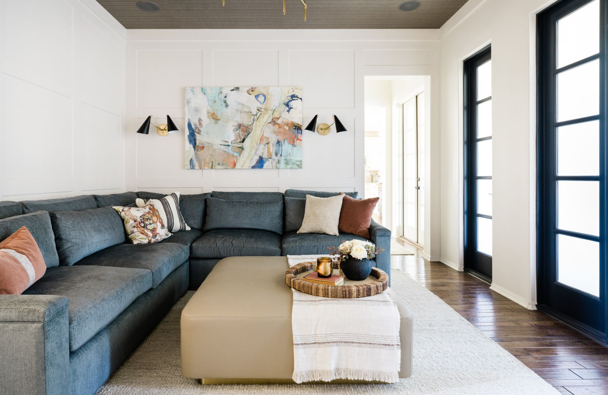 morningside tx living room design modern elegant gray sofa beige ottoman black doors