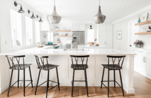 interior-design-hunters-creek-tx-top-renovation-regrets-light-bright-white-kitchen-black-counter-height-stools-natural-wood-elements-organic-remodel