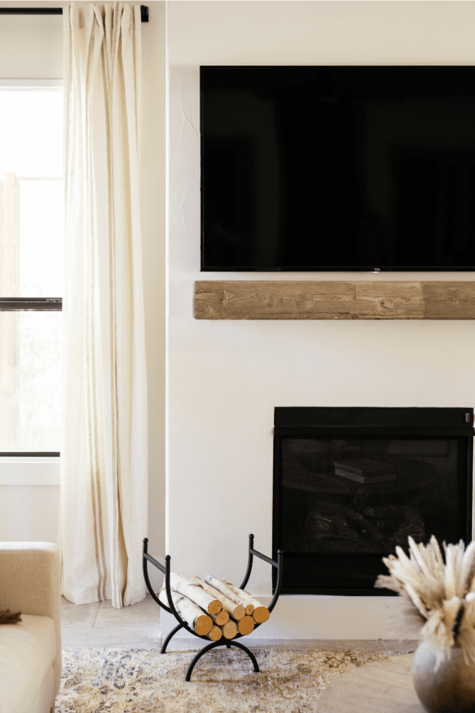 styleberry-creative-interiors-shavano-tx-warm-earth-tone-living-room-renovation-reveal-fireplace-update-skim-coat-modern-mediterranean-wood-mantel-natural-remodel