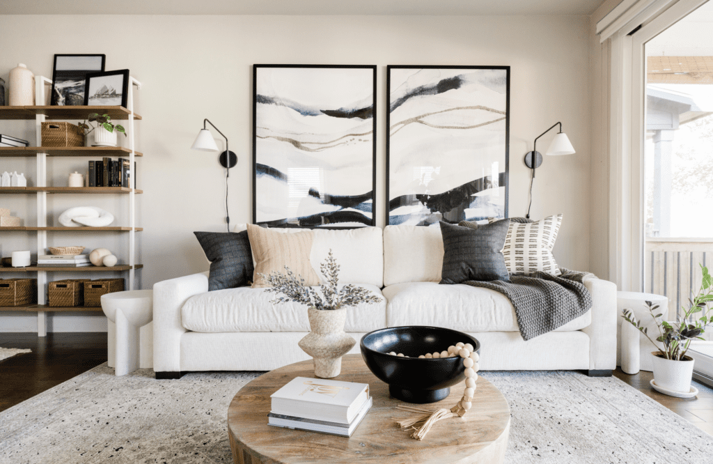 interior-design-hunters-creek-tx-renovate-or-furnish-your-home-living-room-furnishing-project-statement-art-above-sofa-boho-sofa-coffee-table-shelving