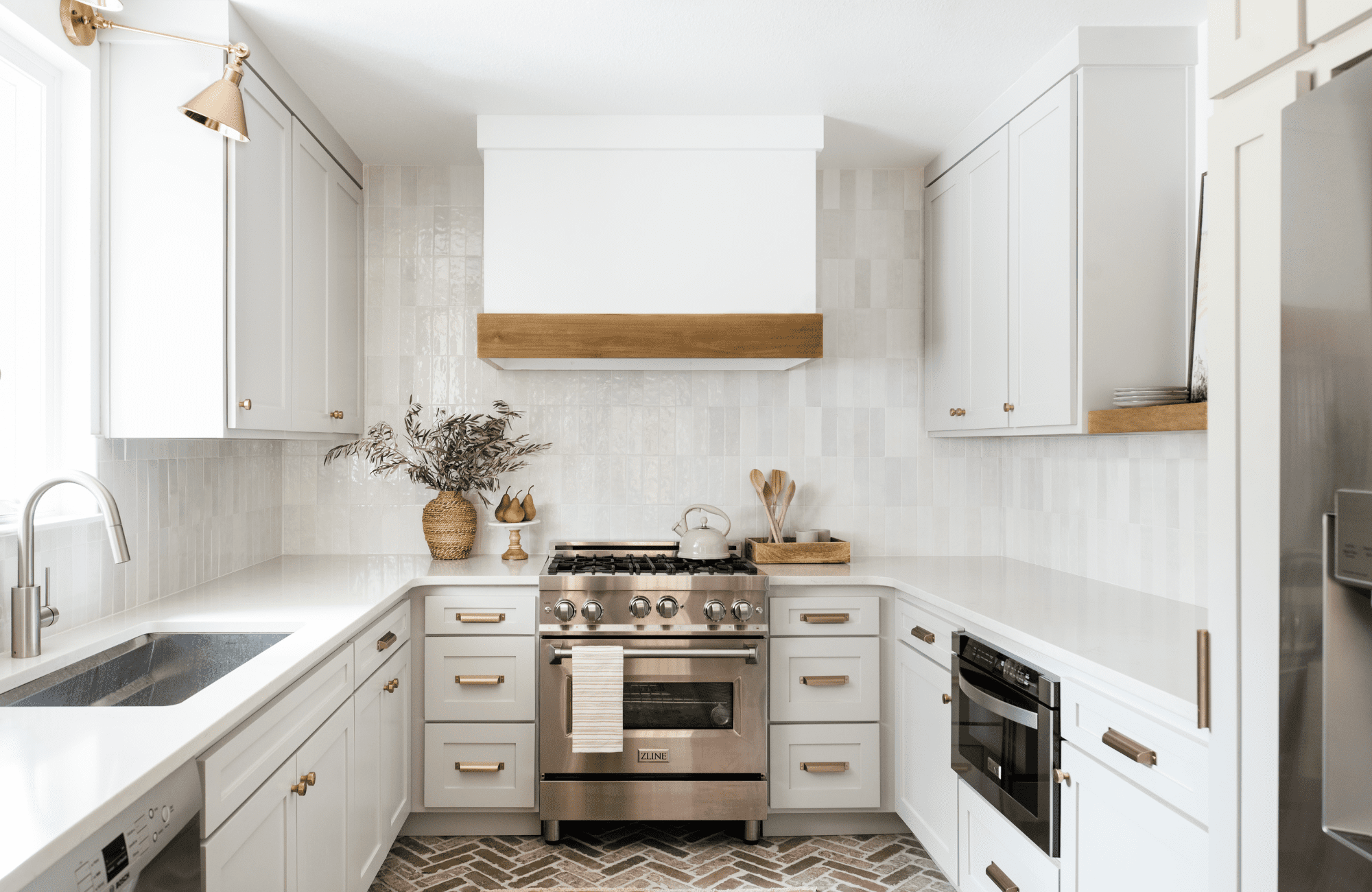 styleberry-creative-interiors-san-antonio-tx-renovate-or-furnish-your-home-small-kitchen-renovation-modern-appliances-brick-flooring-white-cabinets-modern-design