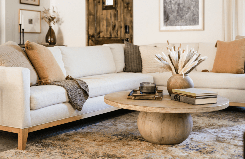 styleberry-creative-interiors-waterford-tx-renovate-or-furnish-your-home-custom-showroom-sectional-sofa-warm-earth-tones-round-coffee-table-organic-interior-design