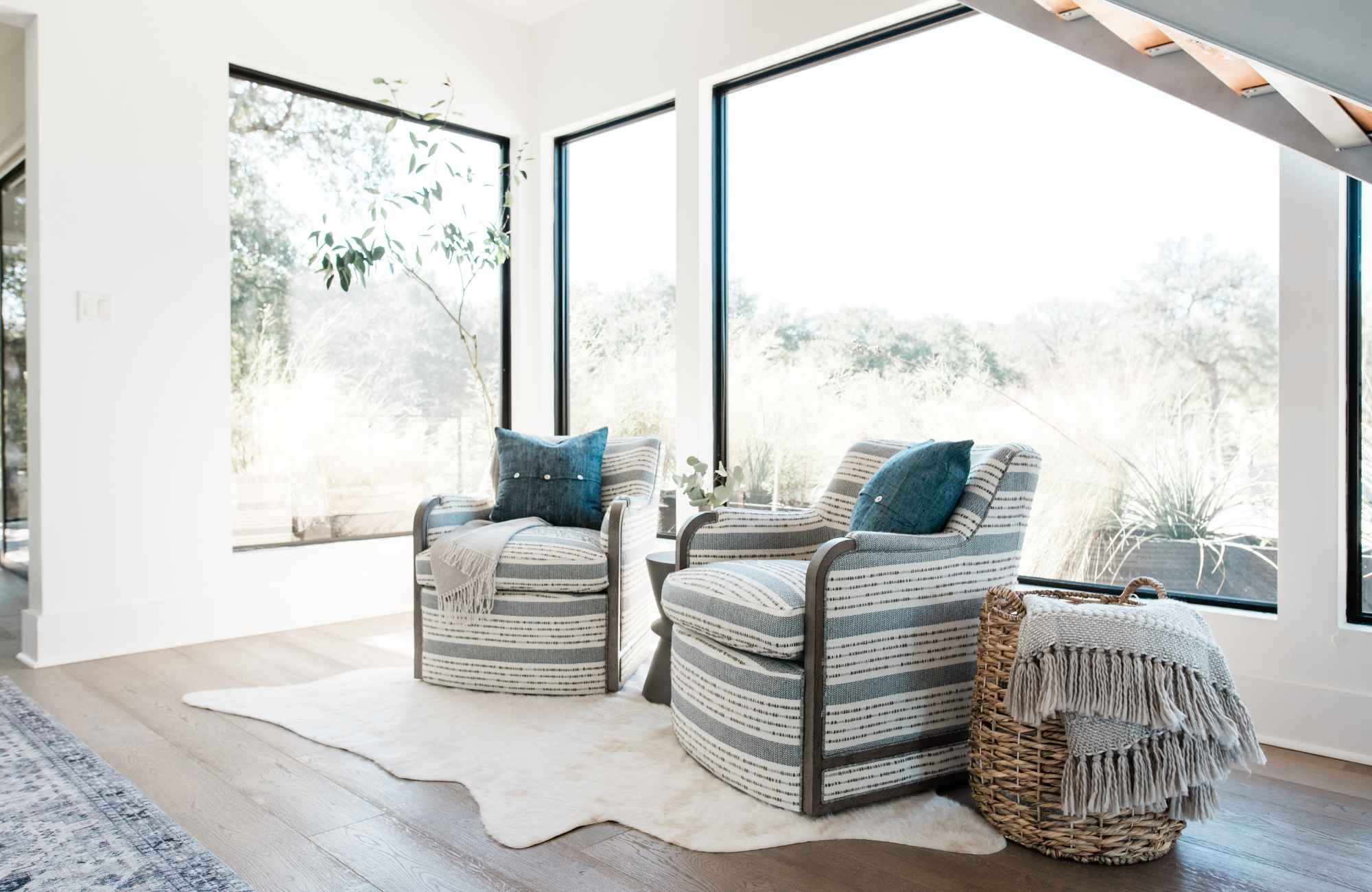 styleberry-creative-interiors-san-antonio-tx-value-engineering-dupe-furniture-custom-upholstered-chairs-blue-and-white-pattern-large-windows-modern-home-renovation