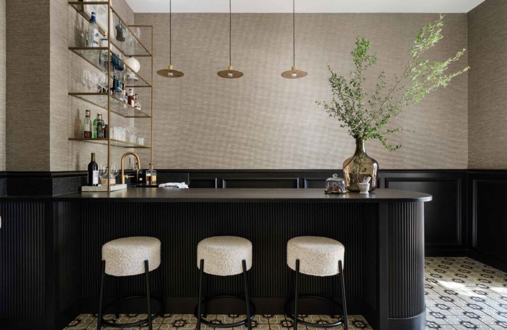 interior-designer-shavano-tx-high-contrast-masculine-minimalist-home-tour-club-room-black-bar-with-ribbed-detail-brass-finishes-custom-bar-shelving