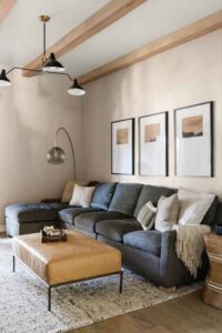 styleberry-creative-interiors-claremont-tx-elegant-minimalist-home-reveal-comfortable-den-blue-custom-sofa-ceiling-beams-modern-renovation