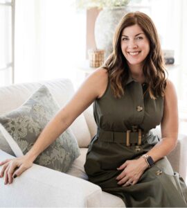 styleberry-creative-interiors-emerald-forest-tx-new-design-consultation-services-shawna-percival-sitting-on-sofa-fresh-design